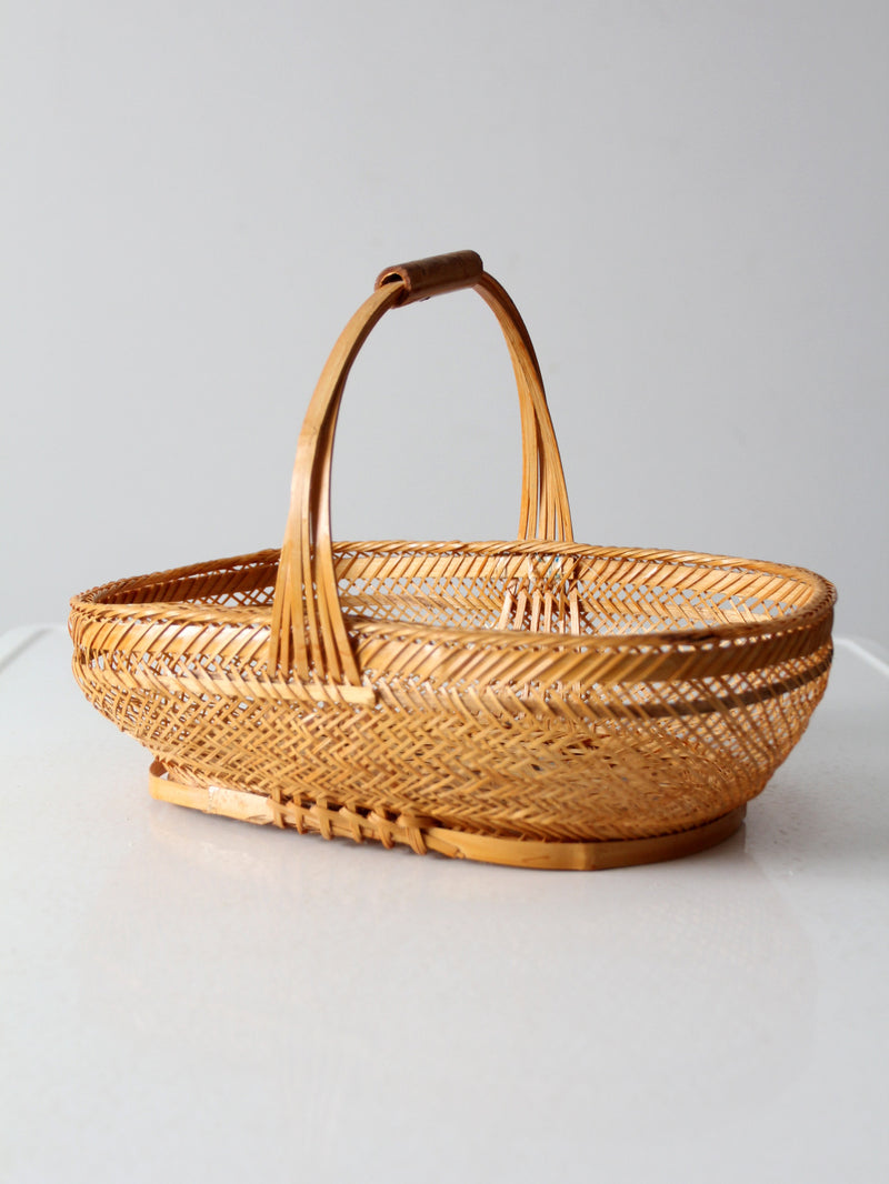 vintage 1970s rattan basket with handle