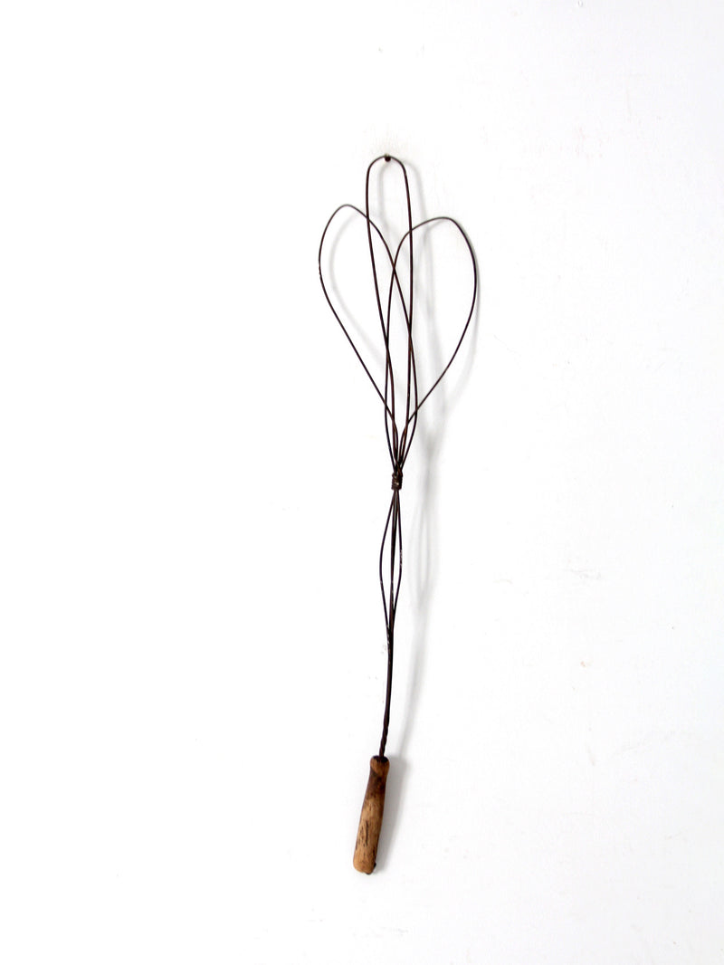 antique rug beater