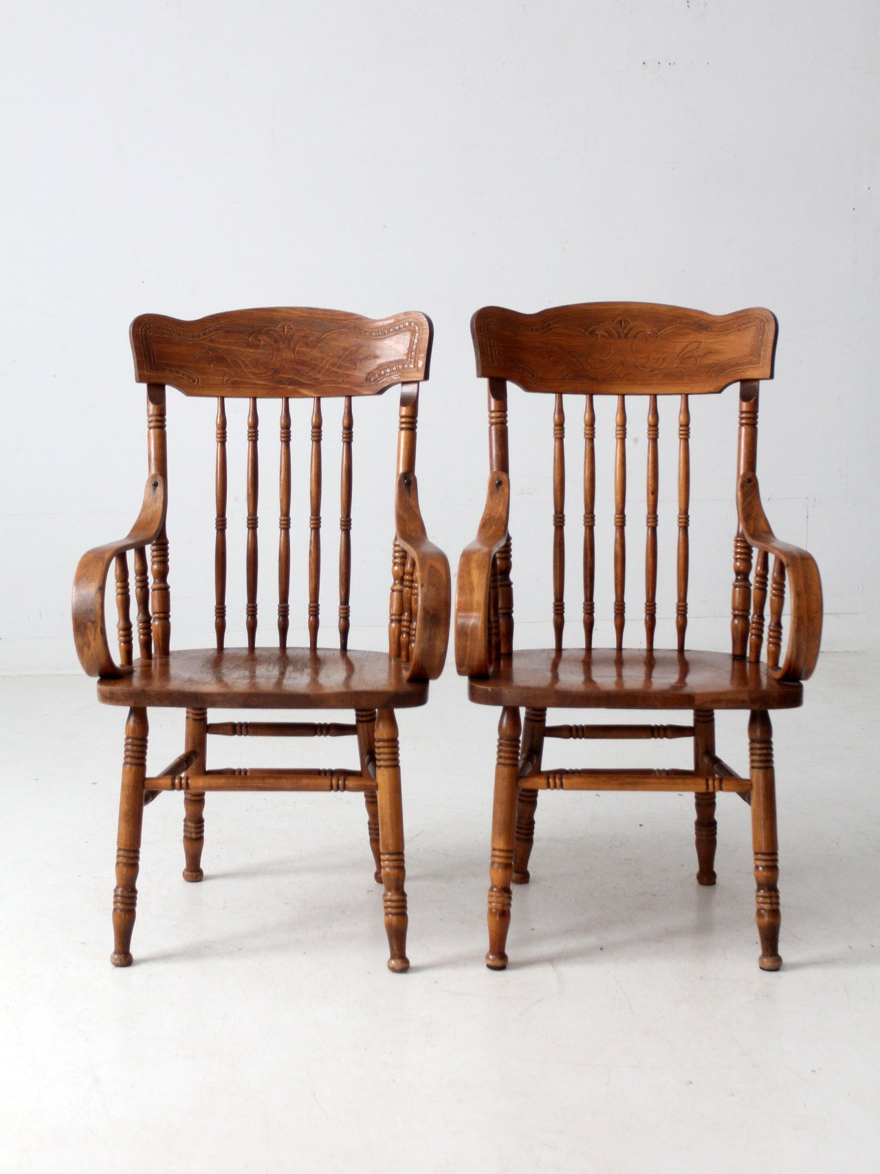pair of vintage press-back back armchairs