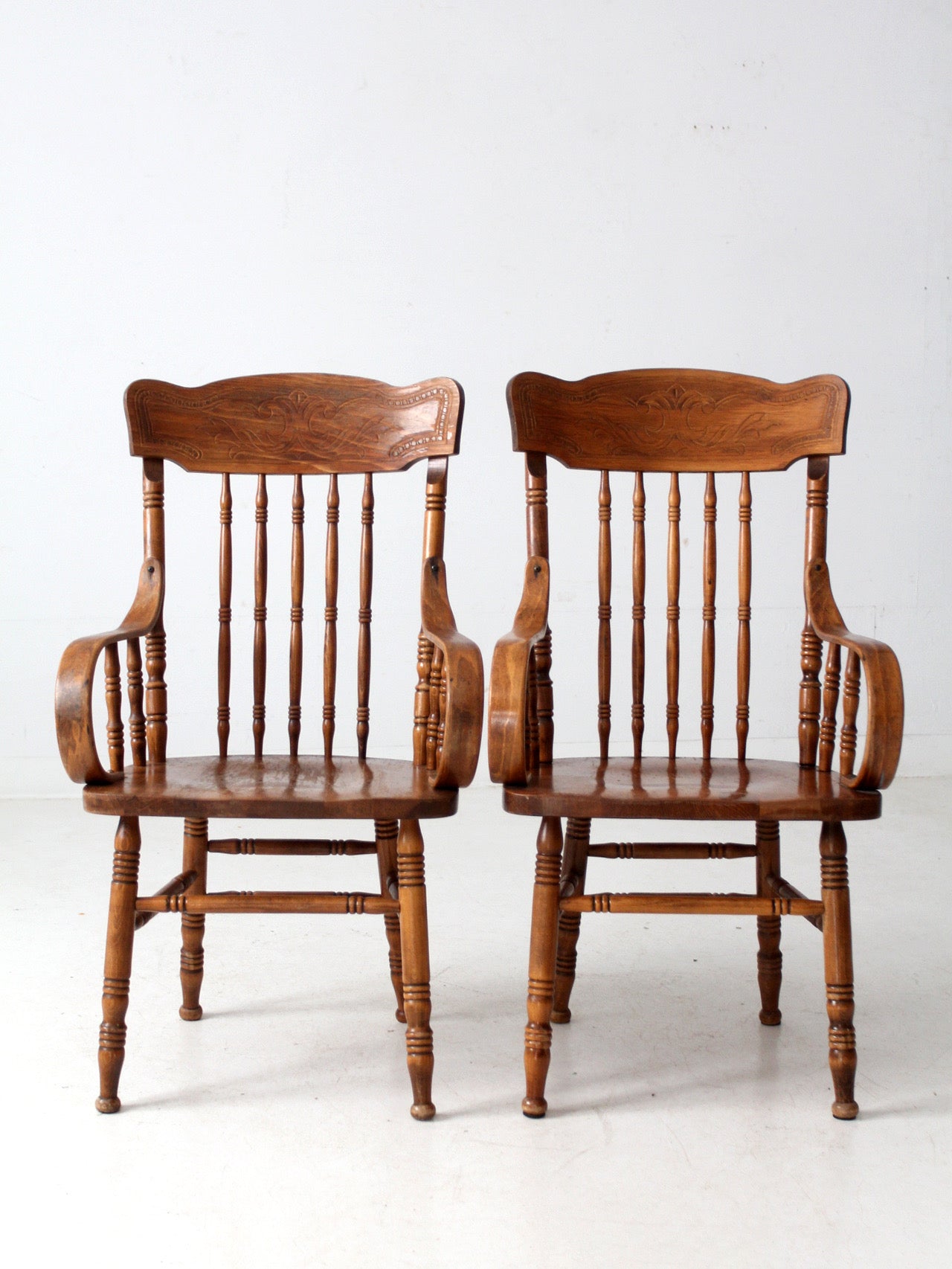 pair of vintage press-back back armchairs