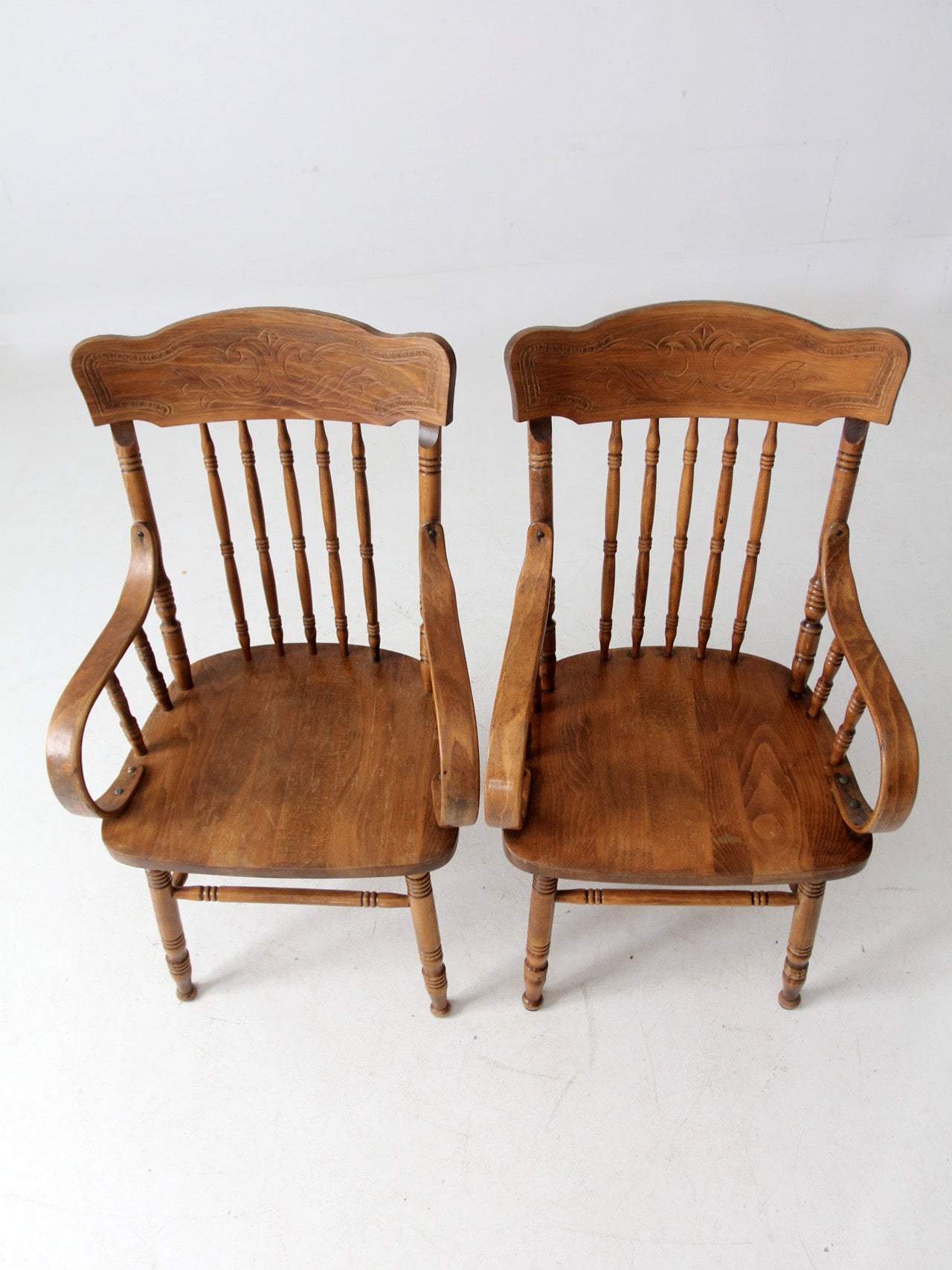 pair of vintage press-back back armchairs