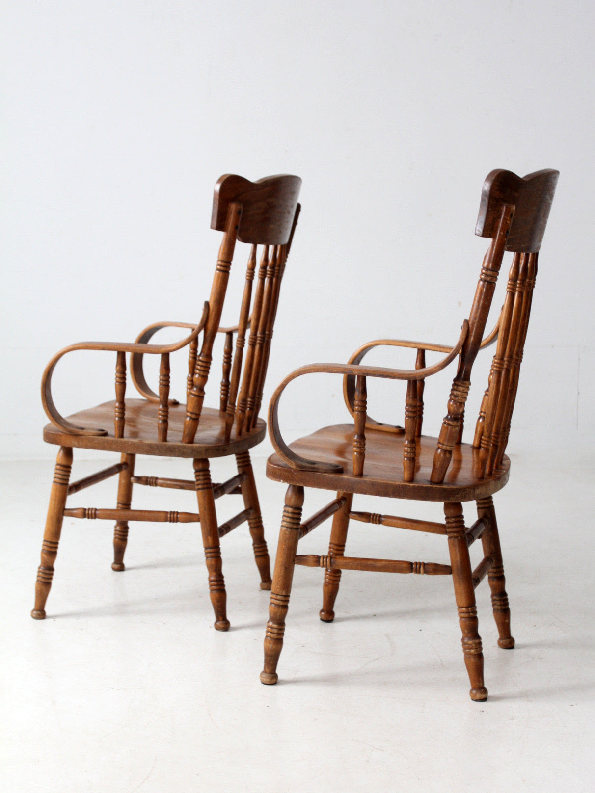 pair of vintage press-back back armchairs