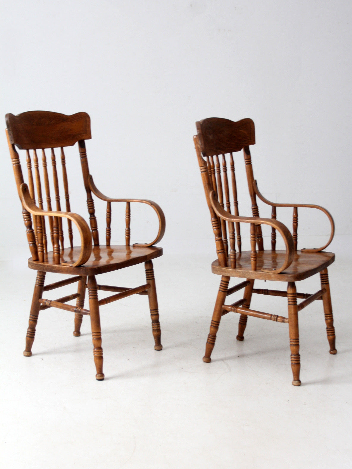 pair of vintage press-back back armchairs