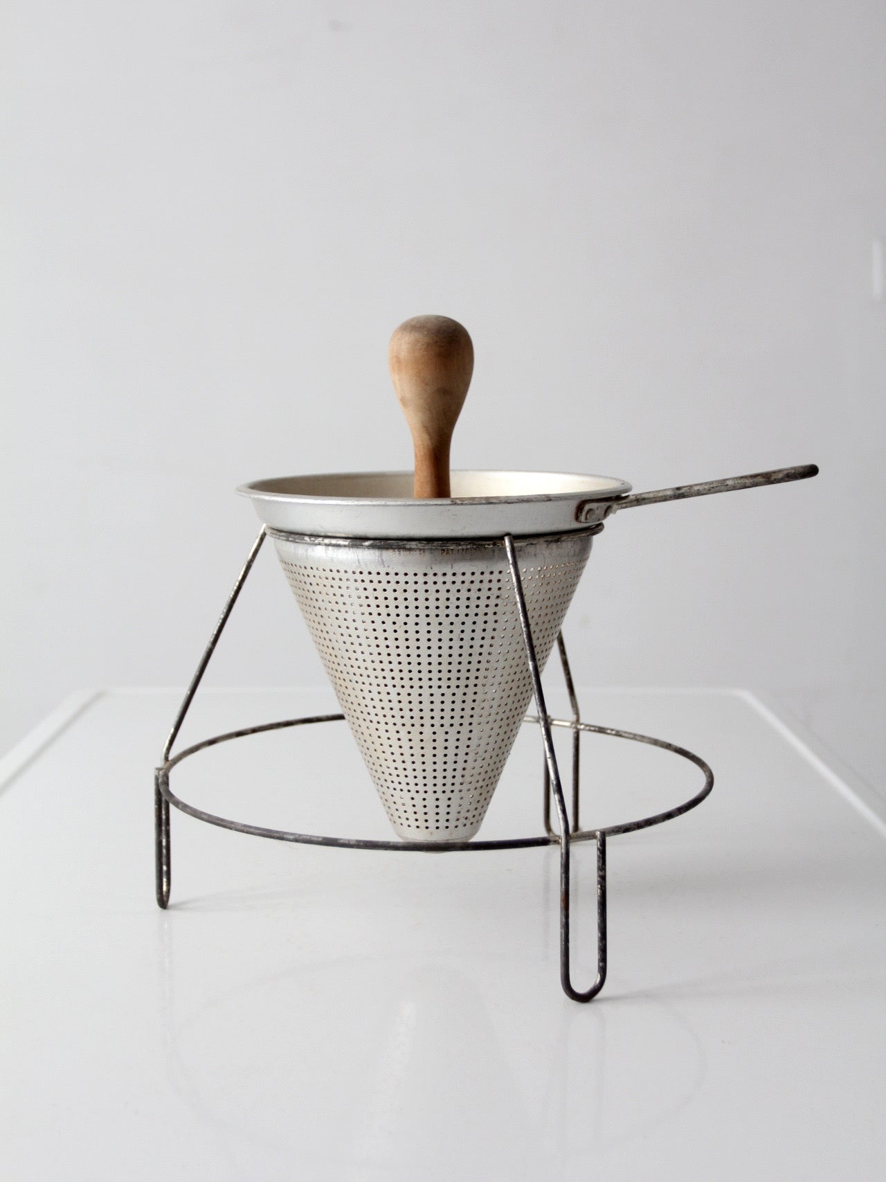 mid-century conical strainer set