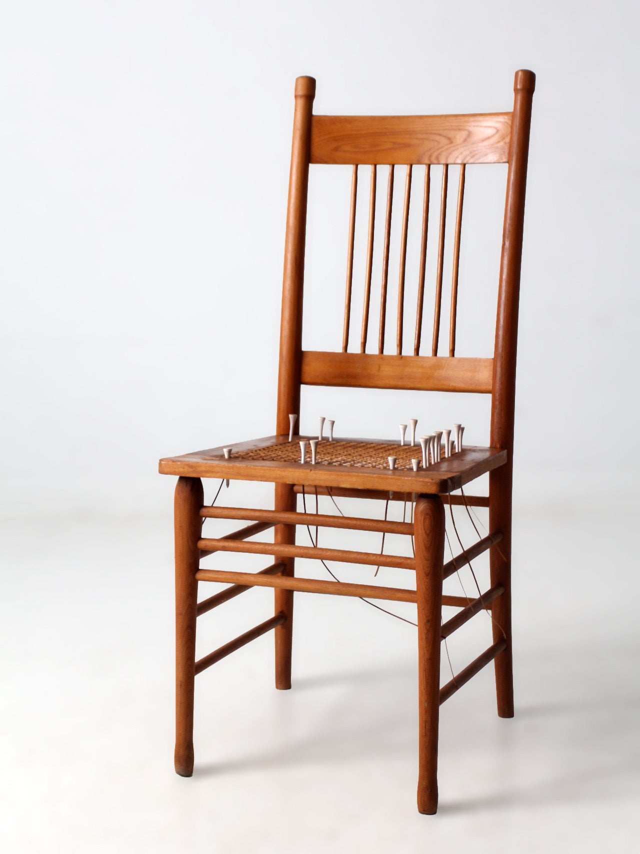 antique spindle back chair art installation | early American form