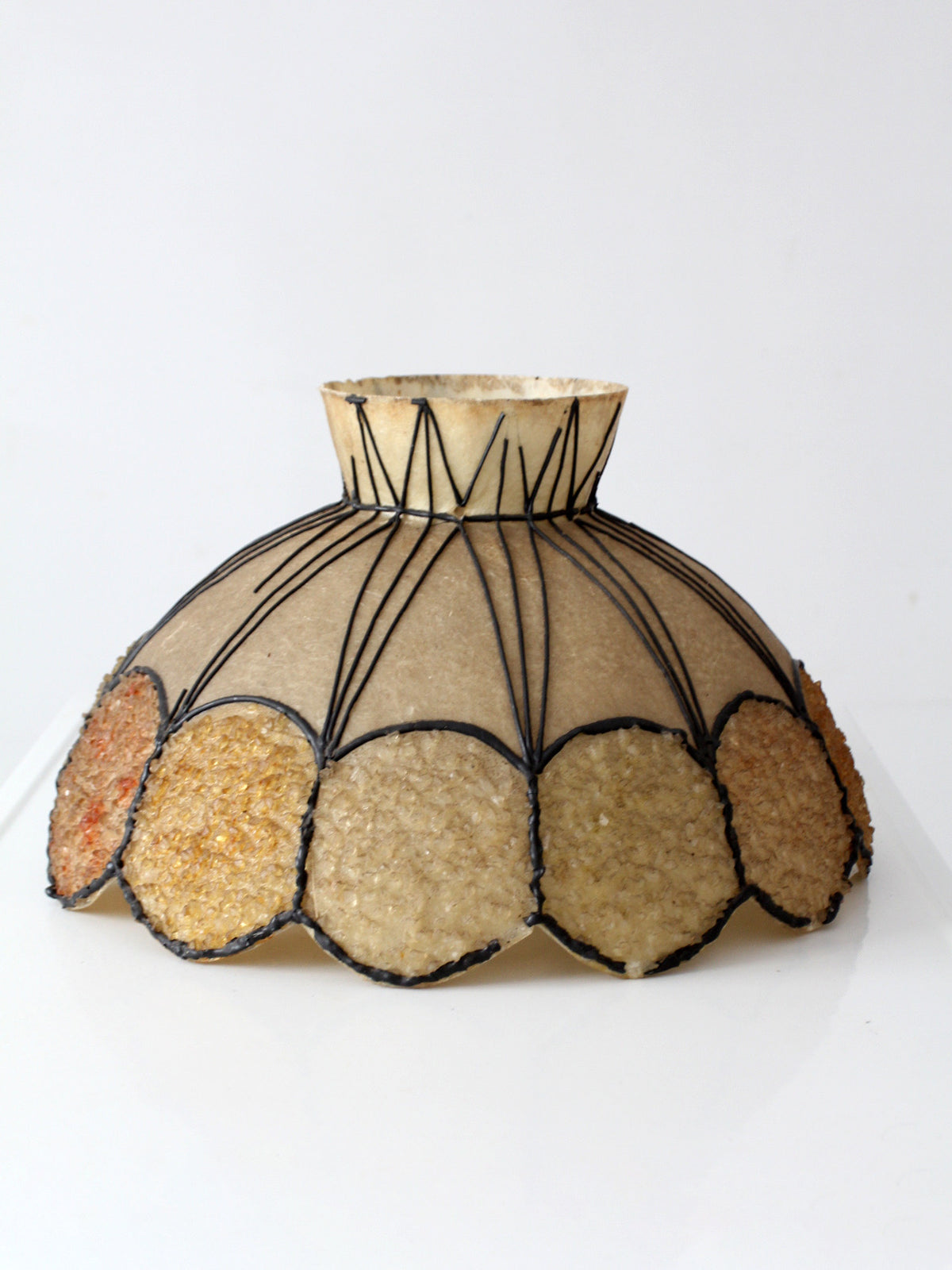 Decorative lampshade with circular patterns on a white background