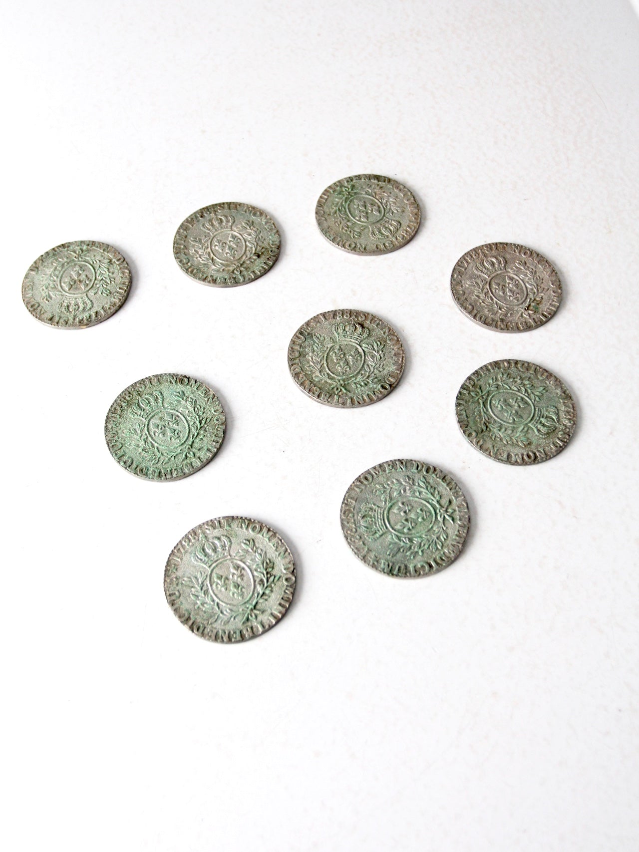 vintage French fleur-de-lis metal coasters set