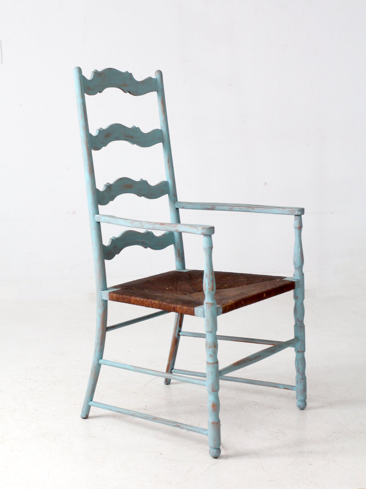vintage painted ladder back chair with rush seat