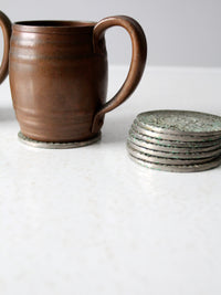 vintage French fleur-de-lis metal coasters set