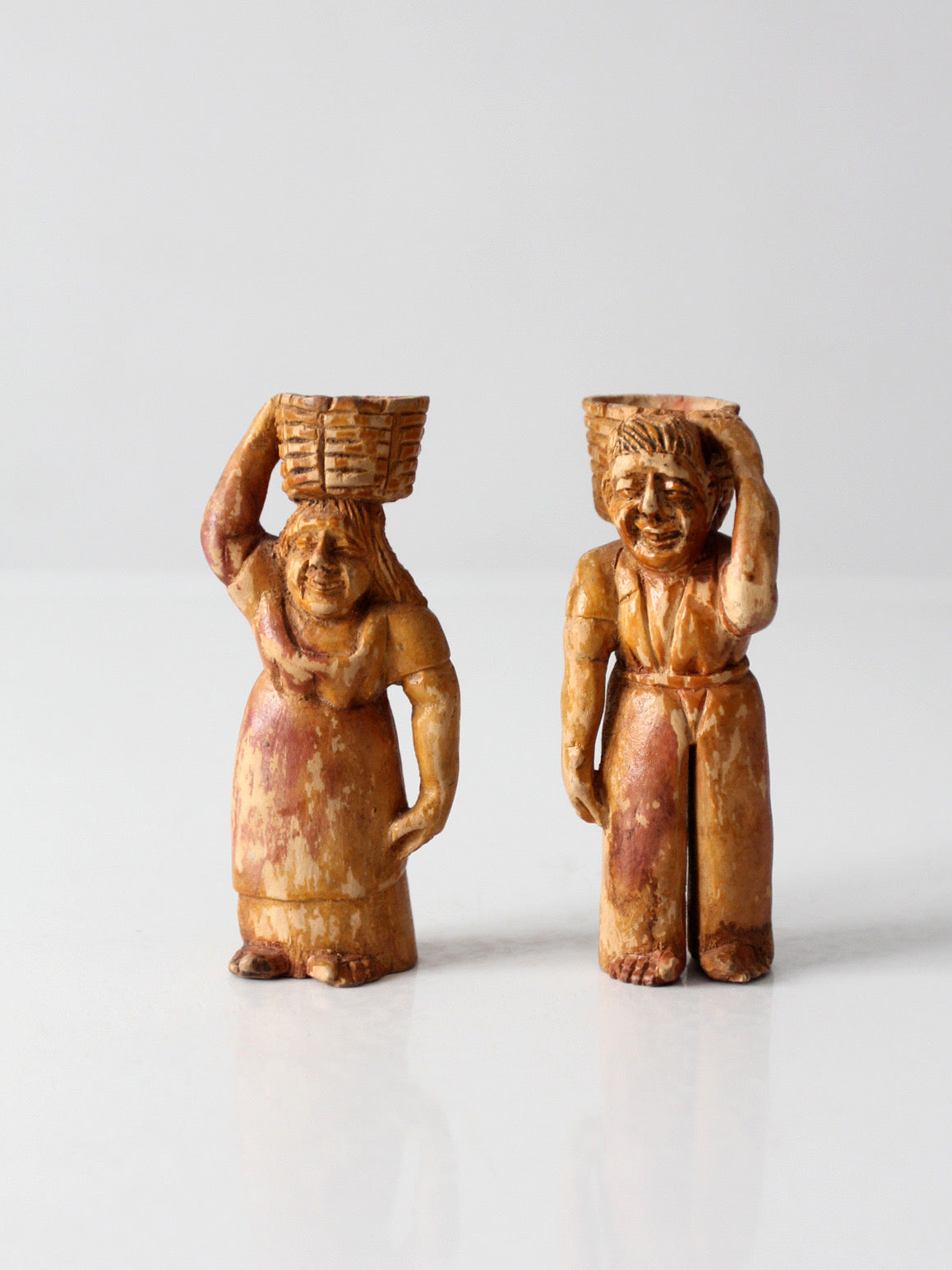 mid-century wood folk art basket carrying figures