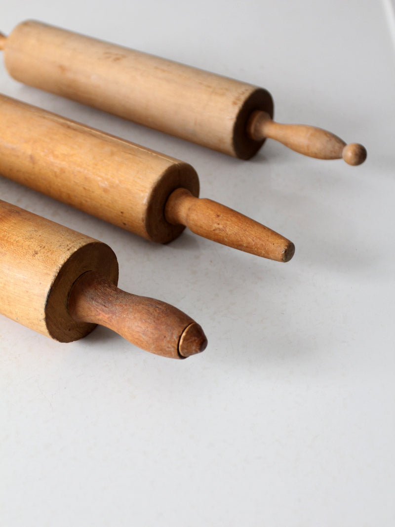set of antique rolling pins