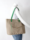 Michael Kors monogram canvas tote bag with green leather handles