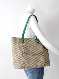 Michael Kors monogram canvas tote bag with green leather handles