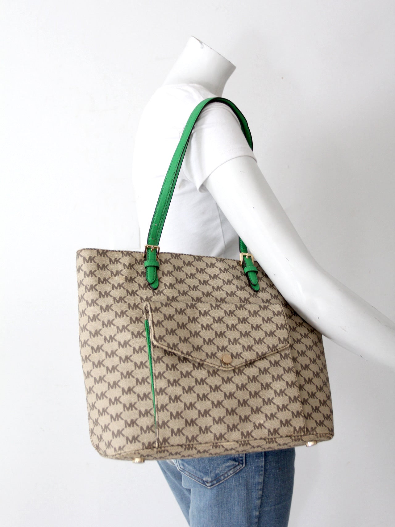 Michael Kors monogram canvas tote bag with green leather handles