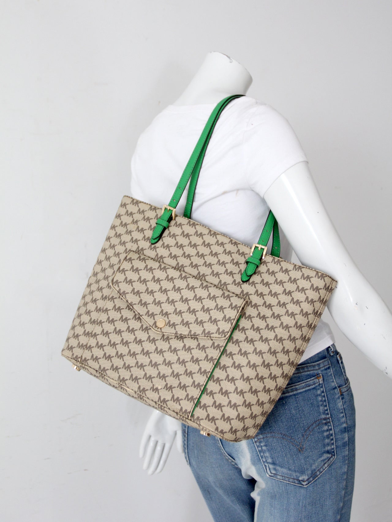 Michael Kors monogram canvas tote bag with green leather handles