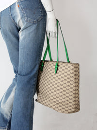 Michael Kors monogram canvas tote bag with green leather handles