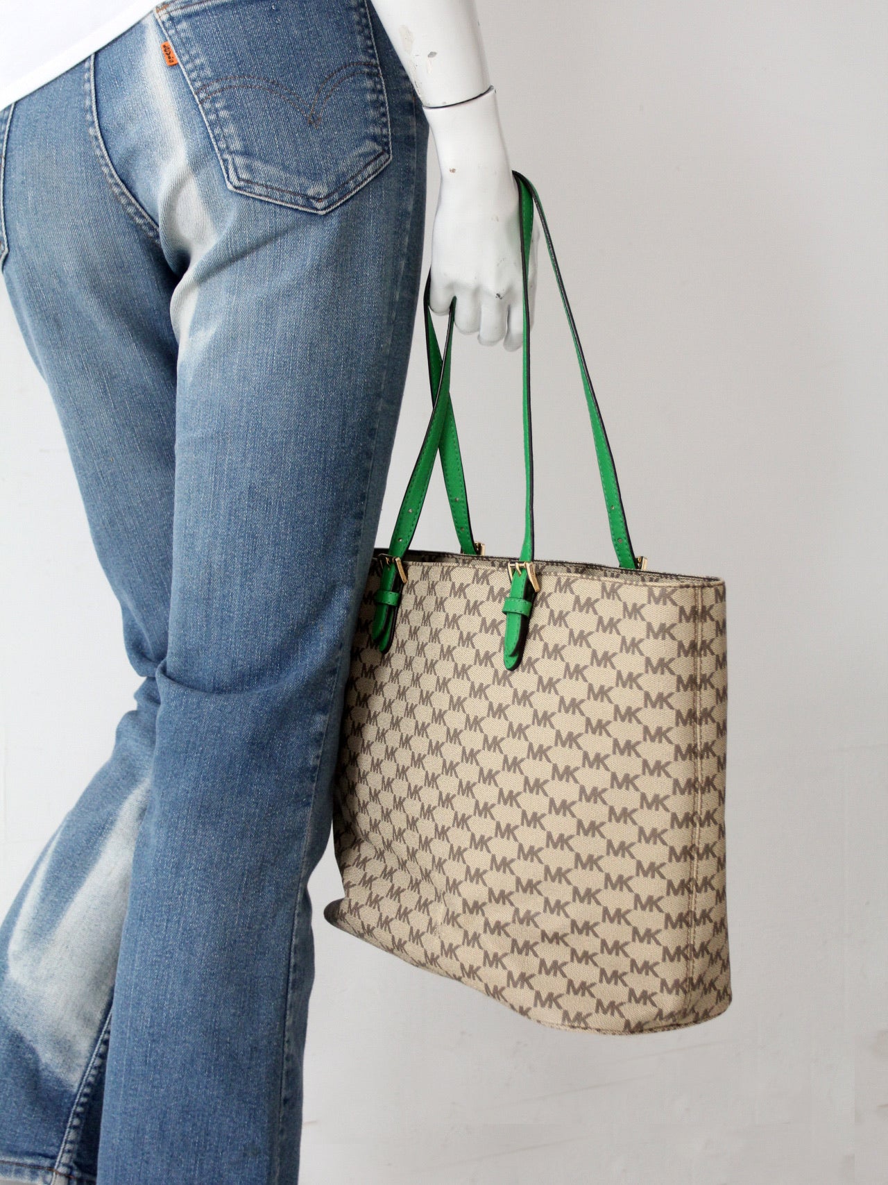 Michael Kors monogram canvas tote bag with green leather handles