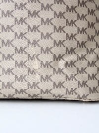 Michael Kors monogram canvas tote bag with green leather handles