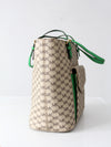 Michael Kors monogram canvas tote bag with green leather handles