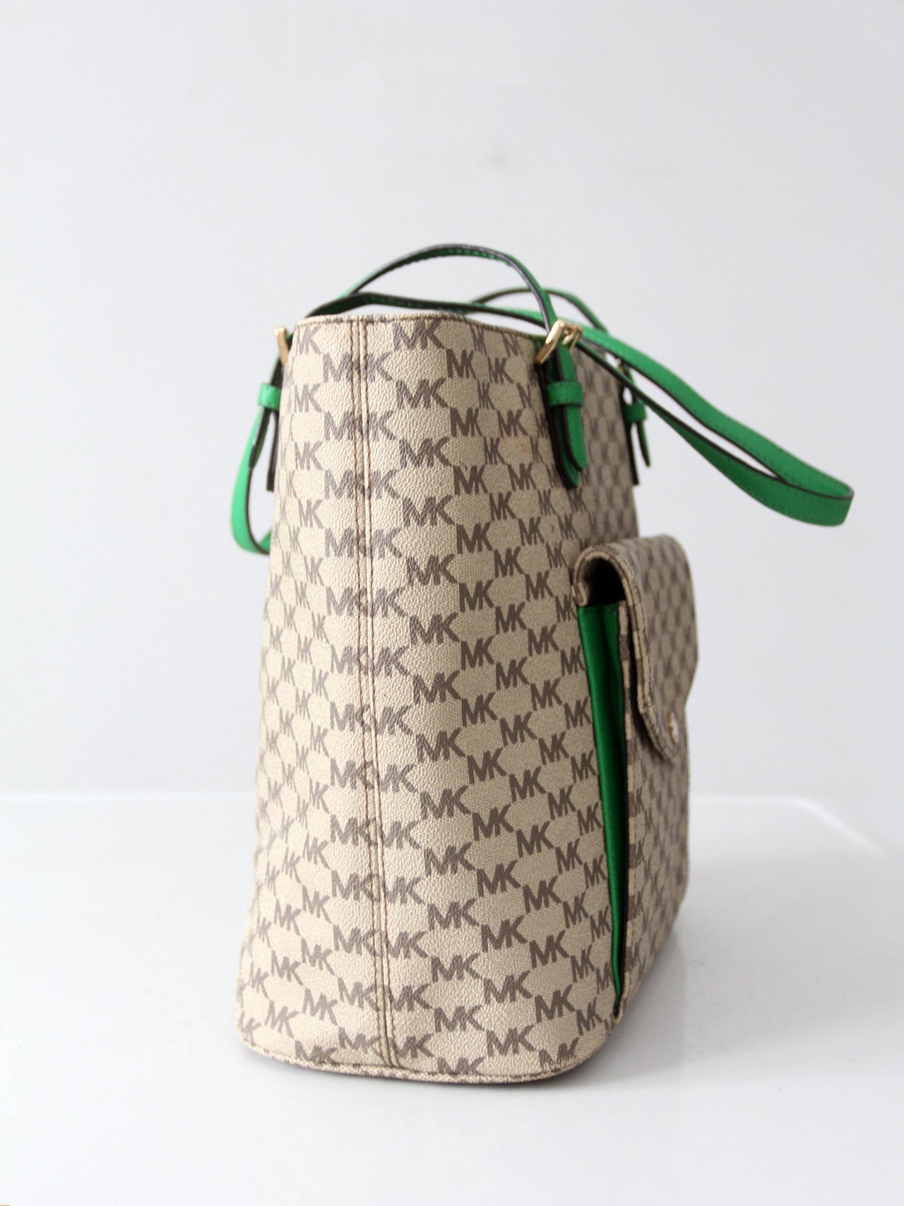 Michael Kors monogram canvas tote bag with green leather handles