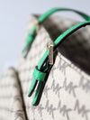 Michael Kors monogram canvas tote bag with green leather handles