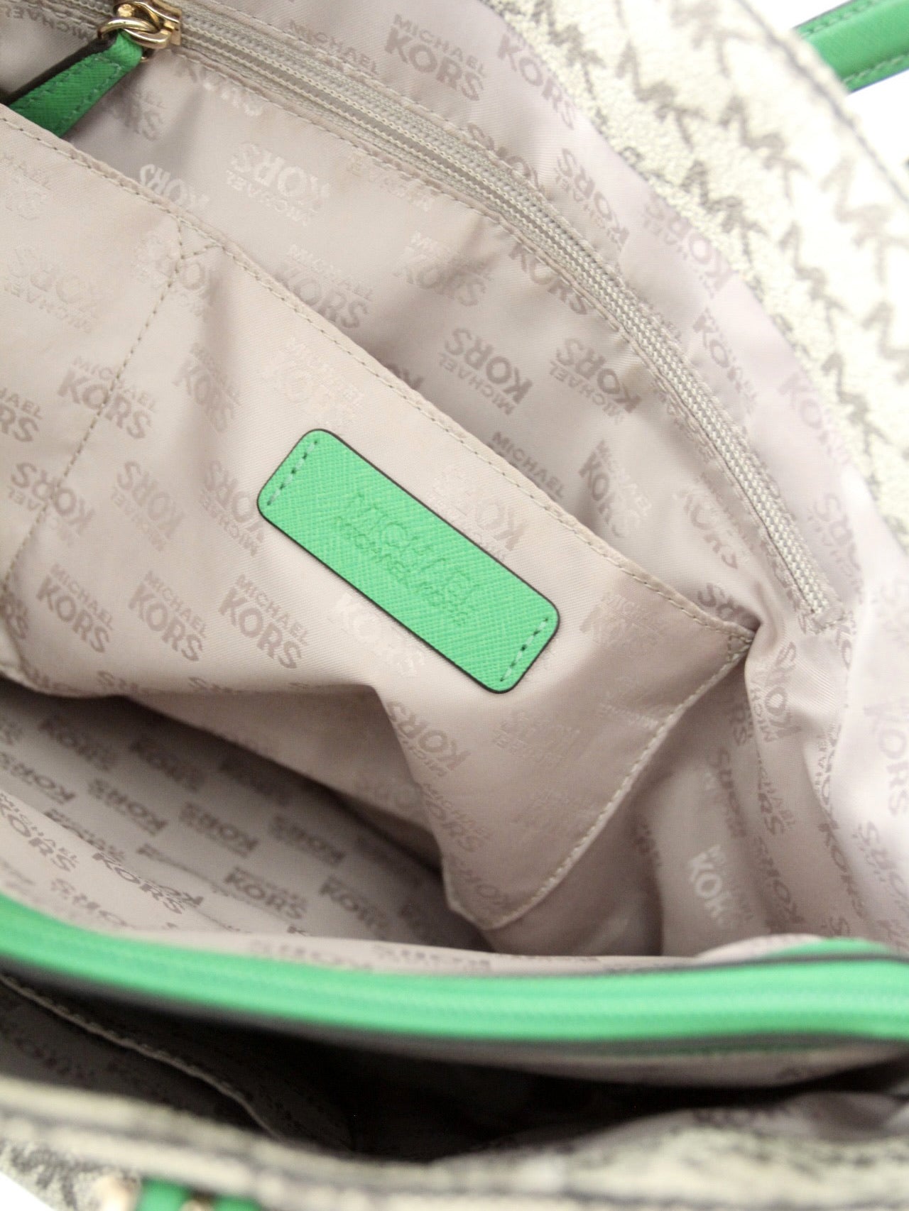 Michael Kors monogram canvas tote bag with green leather handles