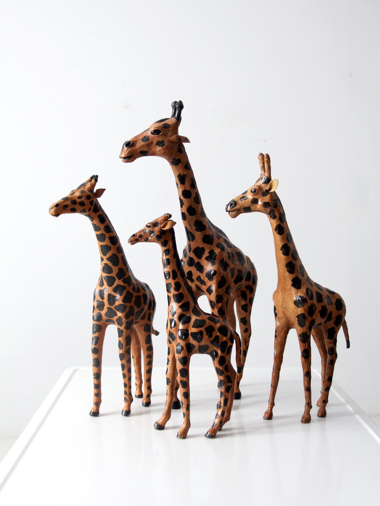 vintage leather giraffe figurines collection
