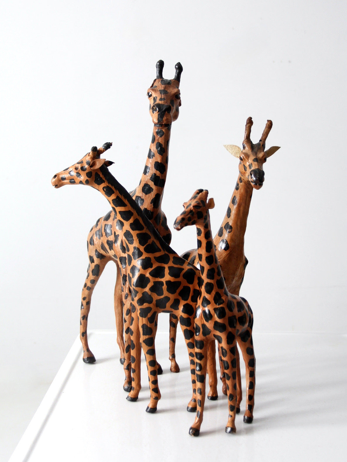 vintage leather giraffe figurines collection
