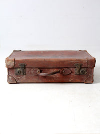 antique leather travel case with railway stickers