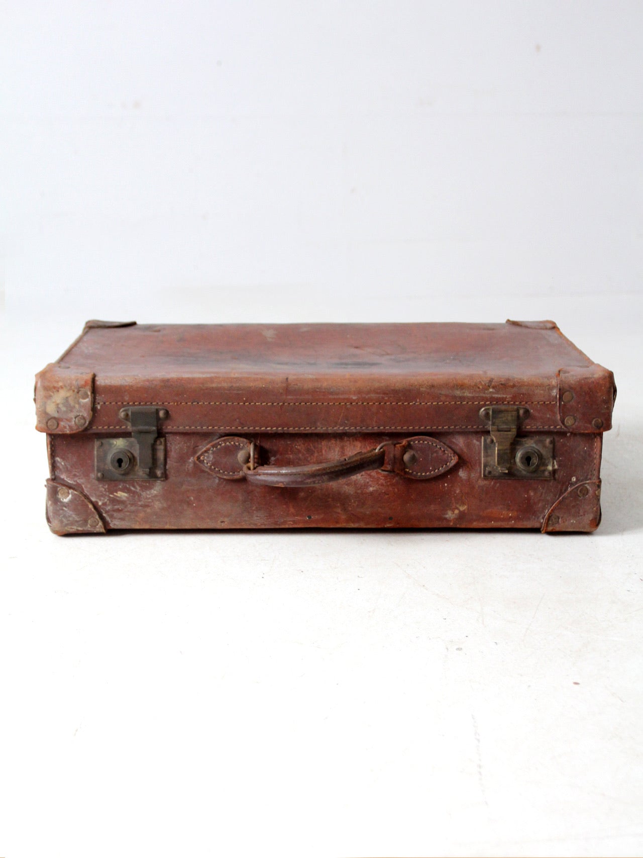 antique leather travel case with railway stickers