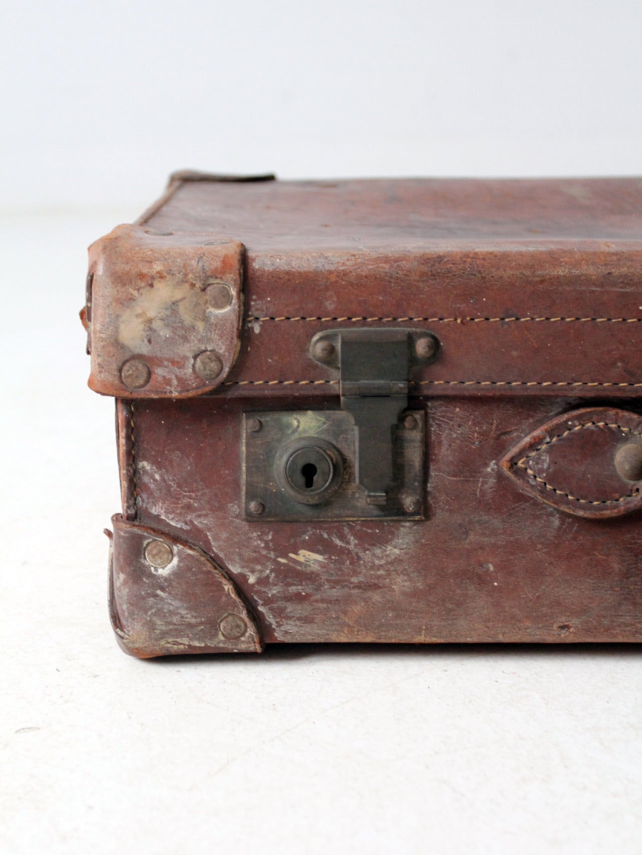 antique leather travel case with railway stickers