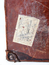 antique leather travel case with railway stickers