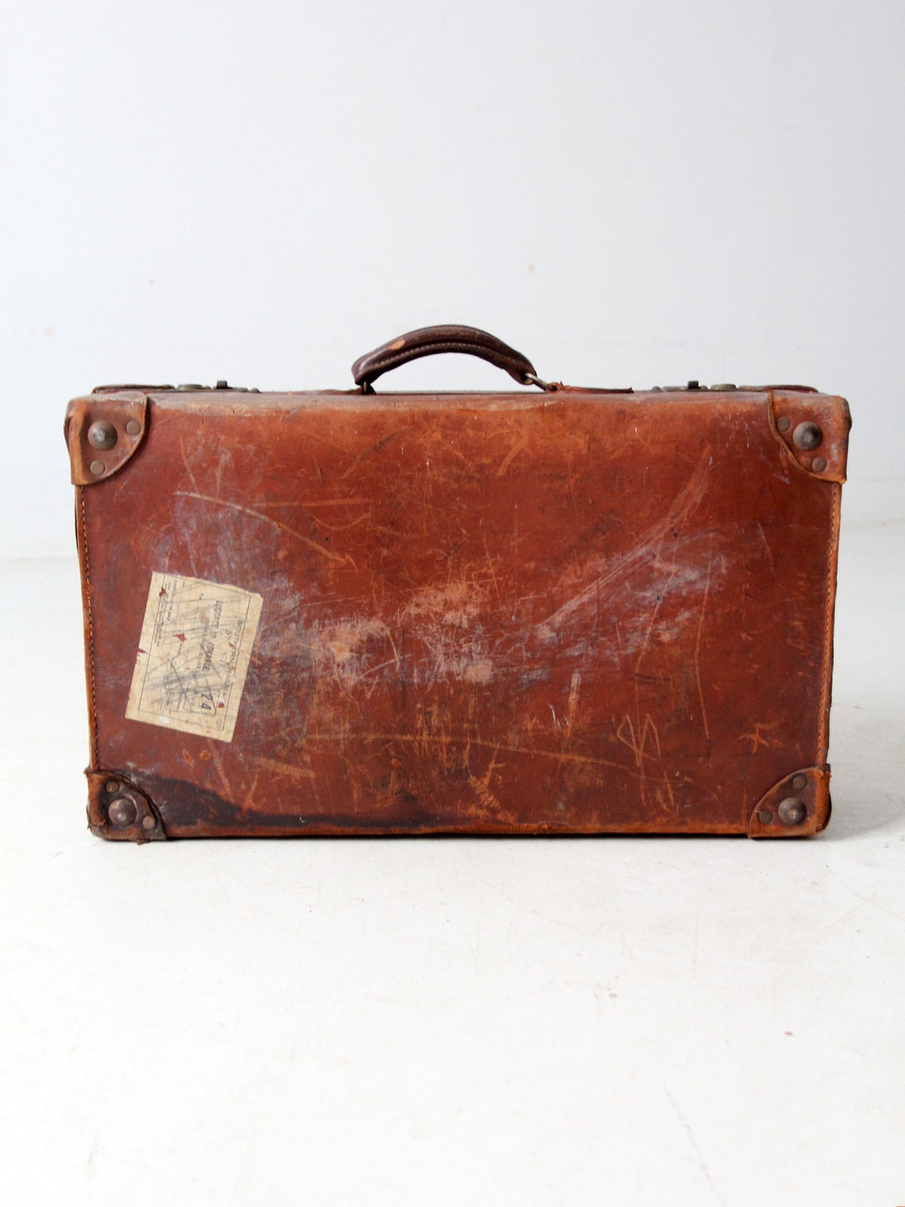antique leather travel case with railway stickers