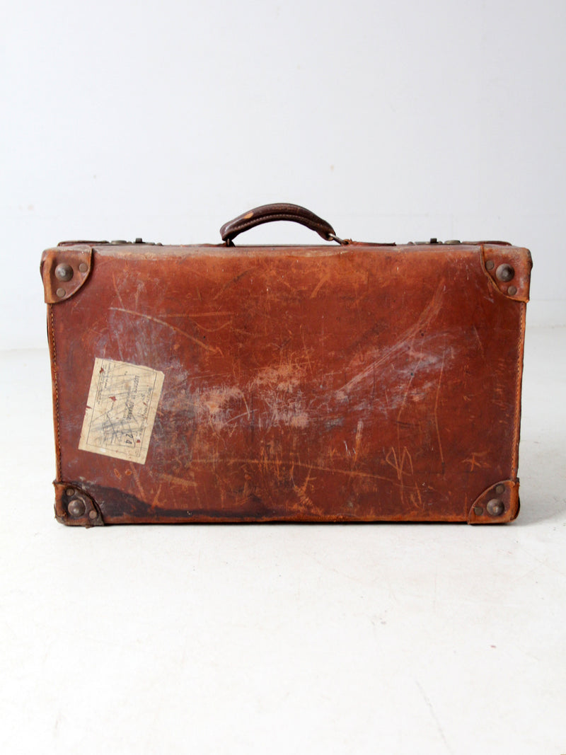 antique leather travel case with railway stickers