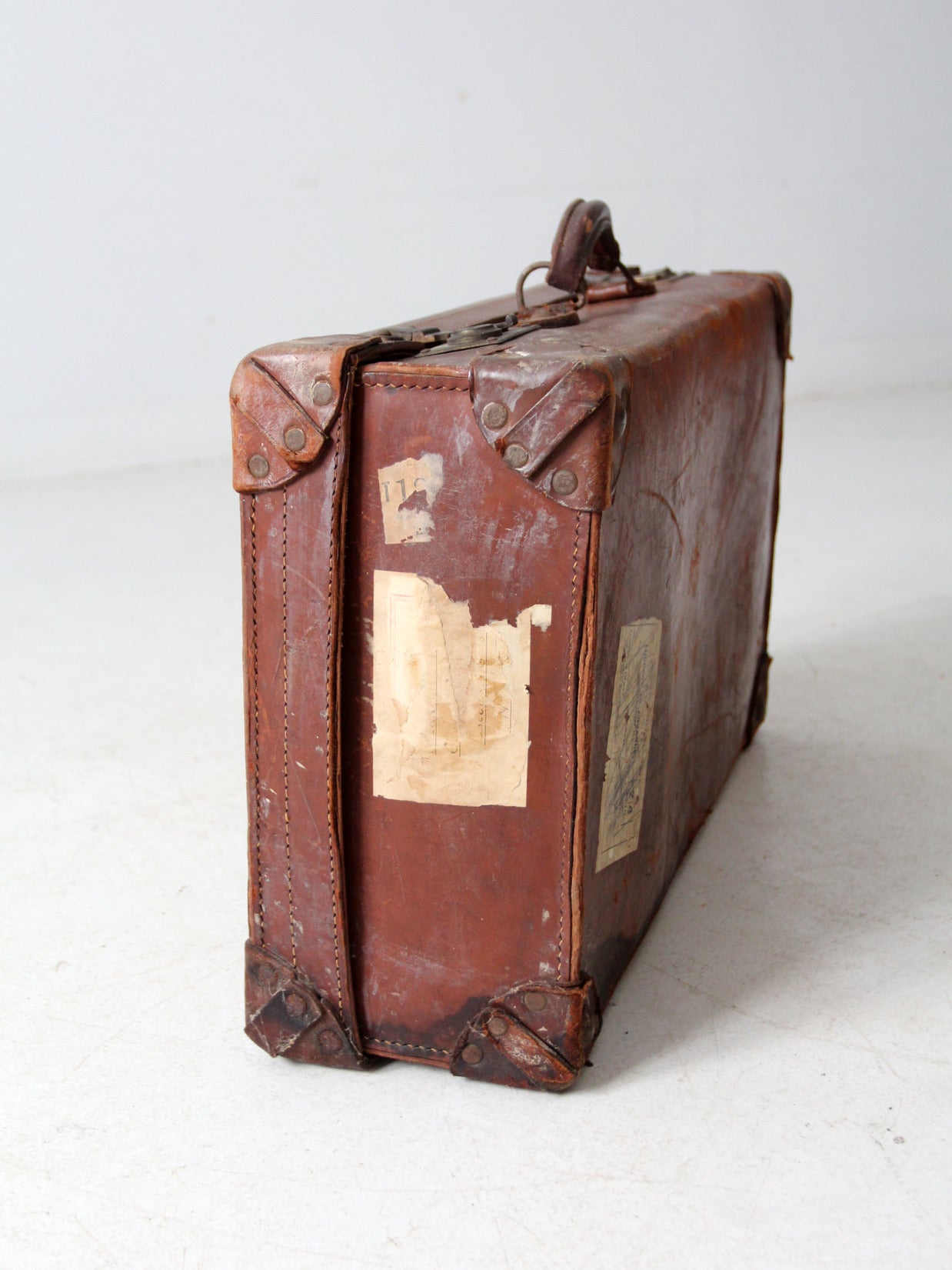 antique leather travel case with railway stickers