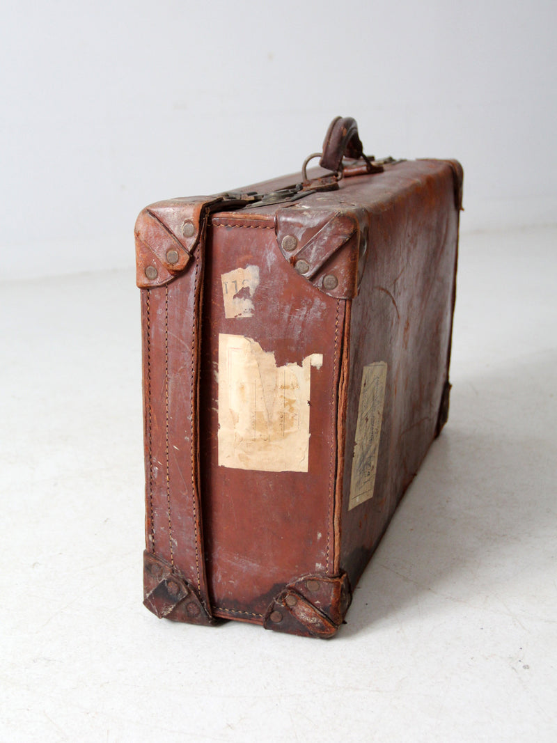 antique leather travel case with railway stickers