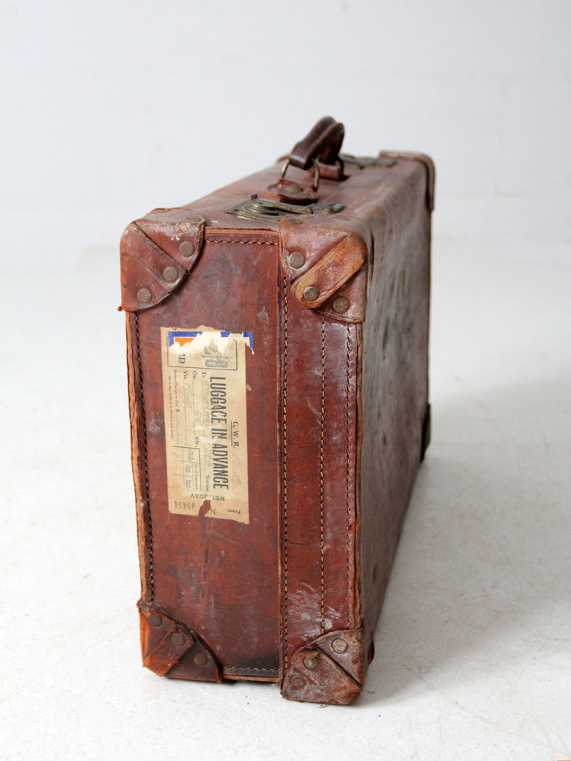 antique leather travel case with railway stickers