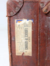 antique leather travel case with railway stickers
