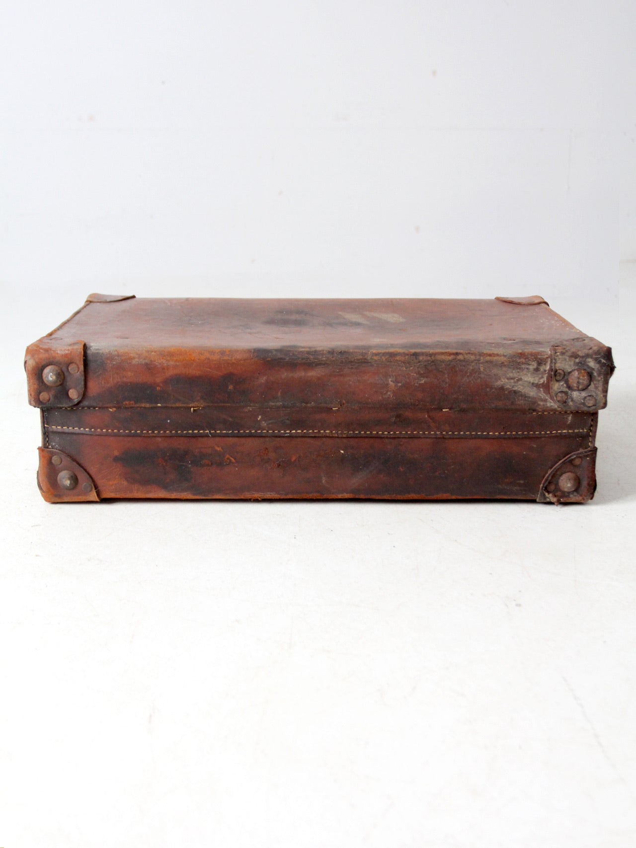 antique leather travel case with railway stickers
