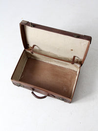 antique leather travel case with railway stickers