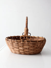 vintage woven gathering basket with bamboo handle