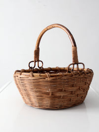vintage woven gathering basket with bamboo handle
