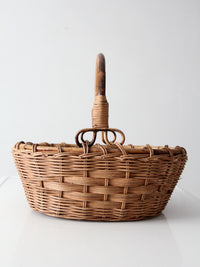 vintage woven gathering basket with bamboo handle