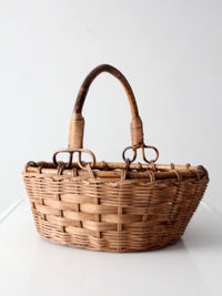 vintage woven gathering basket with bamboo handle