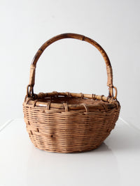 vintage woven gathering basket with bamboo handle