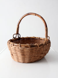 vintage woven gathering basket with bamboo handle