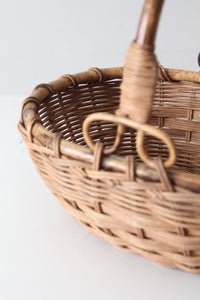 vintage woven gathering basket with bamboo handle