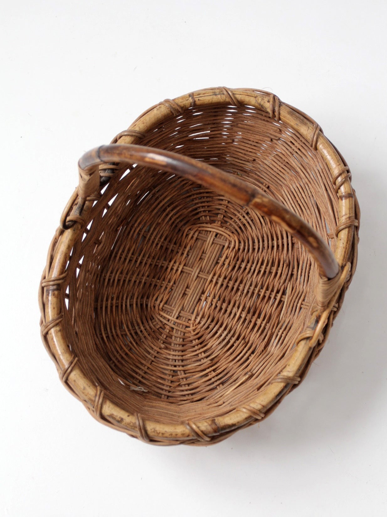 vintage woven gathering basket with bamboo handle