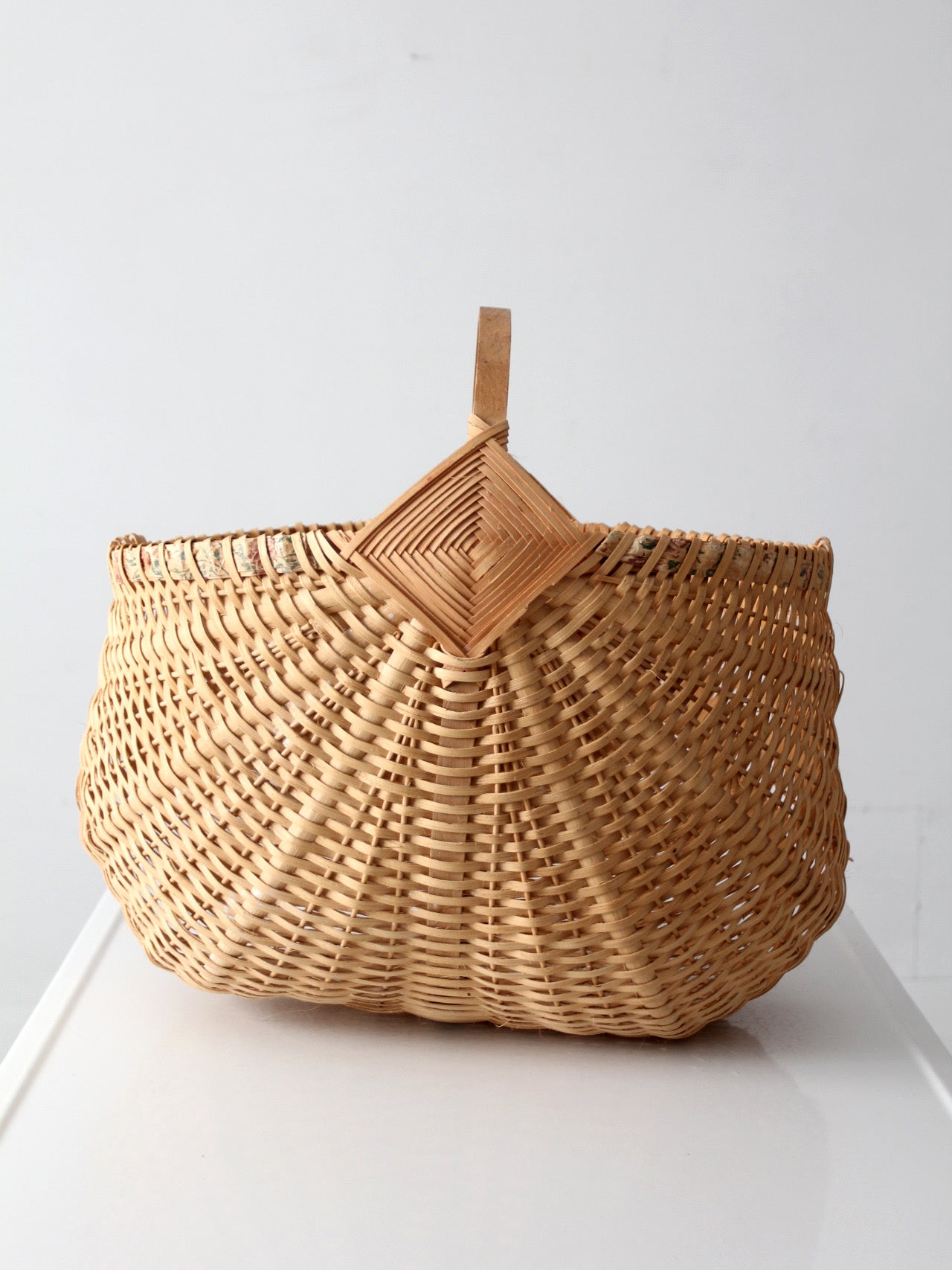 vintage wicker buttocks basket with floral trim