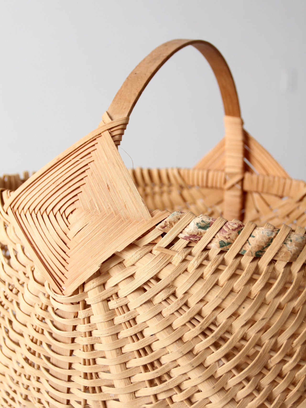 vintage wicker buttocks basket with floral trim